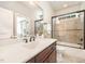 Bathroom featuring a vanity, mirror, and enclosed shower at 7809 Chestnut Branch Ct, Raleigh, NC 27612