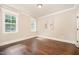 Inviting bedroom with hardwood floors, natural light, and neutral paint at 7809 Chestnut Branch Ct, Raleigh, NC 27612