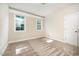 Bright bedroom with large windows and neutral carpet and trim at 7809 Chestnut Branch Ct, Raleigh, NC 27612