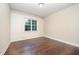 Comfortable bedroom showcasing a large window with decorative trim at 7809 Chestnut Branch Ct, Raleigh, NC 27612