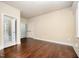 Spacious bedroom featuring hardwood floors, neutral paint, and ample closet space at 7809 Chestnut Branch Ct, Raleigh, NC 27612