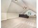 Large bonus room with angled ceilings and theater seating at 7809 Chestnut Branch Ct, Raleigh, NC 27612