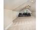 Large bonus room with angled ceilings and theater seating at 7809 Chestnut Branch Ct, Raleigh, NC 27612