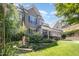 Charming two-story home with manicured landscaping and a welcoming front porch at 7809 Chestnut Branch Ct, Raleigh, NC 27612