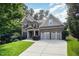 Beautiful two-story brick home with a manicured lawn and a convenient two-car garage at 7809 Chestnut Branch Ct, Raleigh, NC 27612