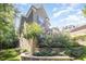 This gorgeous two-story home has an excellent landscape and a brick front porch at 7809 Chestnut Branch Ct, Raleigh, NC 27612