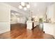Open kitchen with white cabinetry, an island, and stainless steel appliances at 7809 Chestnut Branch Ct, Raleigh, NC 27612