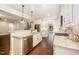 Modern kitchen featuring granite countertops, stainless steel appliances, and hardwood floors at 7809 Chestnut Branch Ct, Raleigh, NC 27612