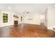 Bright living room featuring dark hardwood floors, a cozy fireplace, and ample natural light at 7809 Chestnut Branch Ct, Raleigh, NC 27612