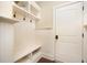 Functional mudroom with built-in storage, hooks, and a bench at 7809 Chestnut Branch Ct, Raleigh, NC 27612
