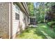 Rear exterior view showcases the home's screened porch and patio at 7809 Chestnut Branch Ct, Raleigh, NC 27612