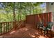 Enjoy this outdoor back deck area surrounded by trees offering privacy to enjoy relaxing outdoors at 8 Mandy Ct, Durham, NC 27707