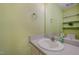 Clean bathroom featuring a vanity, mirror, and shelves at 8 Mandy Ct, Durham, NC 27707