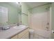 Well-lit bathroom featuring a shower-tub combo, toilet, and a vanity with plenty of counter space at 8 Mandy Ct, Durham, NC 27707