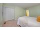 Bright bedroom with ample closet space, a cozy bed, and neutral walls at 8 Mandy Ct, Durham, NC 27707
