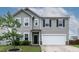 Charming front exterior with gray siding, white trim, and a well-maintained lawn at 8005 Caithness St, Raleigh, NC 27616