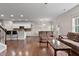 The living area features an open design with hardwood floors, a kitchen island, and a comfortable seating area at 8005 Caithness St, Raleigh, NC 27616