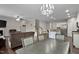 Spacious open-concept living area showcases seamless flow between dining, living room, kitchen, and staircase at 8005 Caithness St, Raleigh, NC 27616