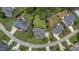 Bird's eye view of the house showcasing its well-maintained lawn, mature trees, and neighborhood at 81 Northcliff Ct, Clayton, NC 27527