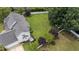 Expansive backyard featuring lush lawn, mature trees, privacy fence and white vinyl fence surrounding property at 81 Northcliff Ct, Clayton, NC 27527