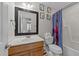 Kid-friendly bathroom featuring colorful decor and a combined shower and tub at 81 Northcliff Ct, Clayton, NC 27527
