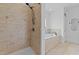 Bright bathroom featuring a walk-in shower and a soaking tub under a window at 81 Northcliff Ct, Clayton, NC 27527