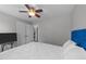Bedroom with a bed, ceiling fan, and neutral walls, creating a calm and inviting space at 81 Northcliff Ct, Clayton, NC 27527
