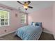 Cozy bedroom with soft pink walls, carpeted floors, and a window with blinds and curtains at 81 Northcliff Ct, Clayton, NC 27527