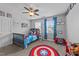 The bedroom boasts a themed bed, colorful rug, and ample space for play and relaxation at 81 Northcliff Ct, Clayton, NC 27527