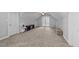 Bonus room featuring french doors, neutral walls, and a cozy sitting area at 81 Northcliff Ct, Clayton, NC 27527