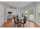 Eat-in kitchen area with a glass table, comfortable seating, and natural light at 81 Northcliff Ct, Clayton, NC 27527