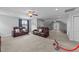 Bright living room with plush carpeting, two sofas, and access to an outdoor balcony at 81 Northcliff Ct, Clayton, NC 27527