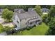 Aerial view of a large home with a covered back porch and manicured lawn at 81 Northcliff Ct, Clayton, NC 27527