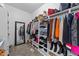 Spacious walk-in closet with ample shelving and hanging space for clothes and accessories at 81 Northcliff Ct, Clayton, NC 27527