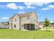 Exterior of house showing backyard with screened in porch and a two car garage at 81 Olive Branch Dr, Smithfield, NC 27577
