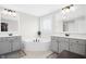 Bright bathroom with double vanities, soaking tub, and modern fixtures at 81 Olive Branch Dr, Smithfield, NC 27577