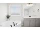 Relaxing bathroom with a soaking tub, tiled floors, and a modern vanity with ample counter space at 81 Olive Branch Dr, Smithfield, NC 27577