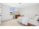 Comfortable bedroom with carpeted floors, a sunny window, and a bed with a cozy comforter at 81 Olive Branch Dr, Smithfield, NC 27577