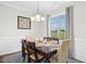 Cozy dining room with natural lighting, a dark wood table, and seating for six at 81 Olive Branch Dr, Smithfield, NC 27577