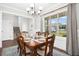 Elegant dining room with a large window, chandelier, and set table at 81 Olive Branch Dr, Smithfield, NC 27577