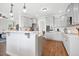 Bright kitchen with gray cabinets, stainless steel appliances, and a kitchen island with pendant lighting at 81 Olive Branch Dr, Smithfield, NC 27577