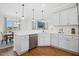 Well-lit kitchen with stainless steel appliances, white countertops, and a view into the dining area at 81 Olive Branch Dr, Smithfield, NC 27577