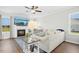 Cozy living room featuring a fireplace, large sofa, and natural light at 81 Olive Branch Dr, Smithfield, NC 27577