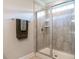 This bathroom showcases a frameless shower with chrome hardware and tiled walls for a sleek, modern feel at 857 Stable Fern Dr, Fuquay Varina, NC 27526