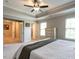 This primary bedroom features a trey ceiling, lots of natural light, and neutral paint, creating a serene retreat at 857 Stable Fern Dr, Fuquay Varina, NC 27526