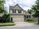 Charming two-story home featuring a welcoming front porch and attached two car garage at 857 Stable Fern Dr, Fuquay Varina, NC 27526