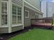 Backyard view of house, with deck and lawn at 8640 Swarthmore Dr, Raleigh, NC 27615