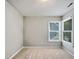 Small bedroom with a pair of windows at 8640 Swarthmore Dr, Raleigh, NC 27615