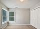 Cozy bedroom features double window and a built-in closet at 8640 Swarthmore Dr, Raleigh, NC 27615