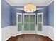 Elegant dining room with custom millwork, natural light, and stylish design at 8640 Swarthmore Dr, Raleigh, NC 27615